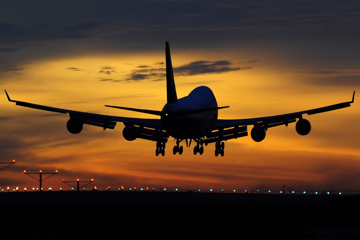 Picture of a airline airplane taking off during sunset